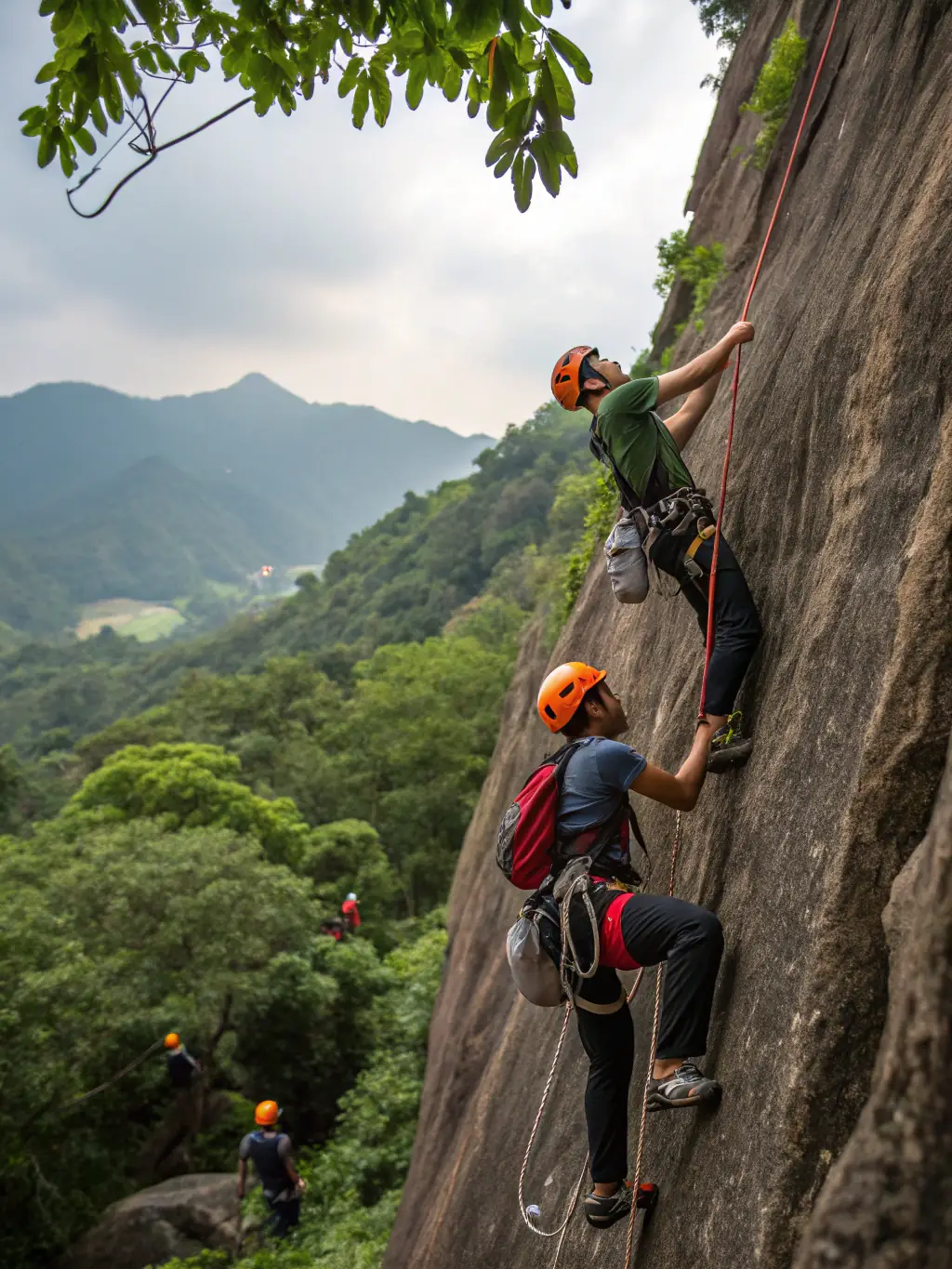 Participants rappelling down a cliff face during an outdoor adventure activity organized by ADO Les Araignées de l'Ouest.